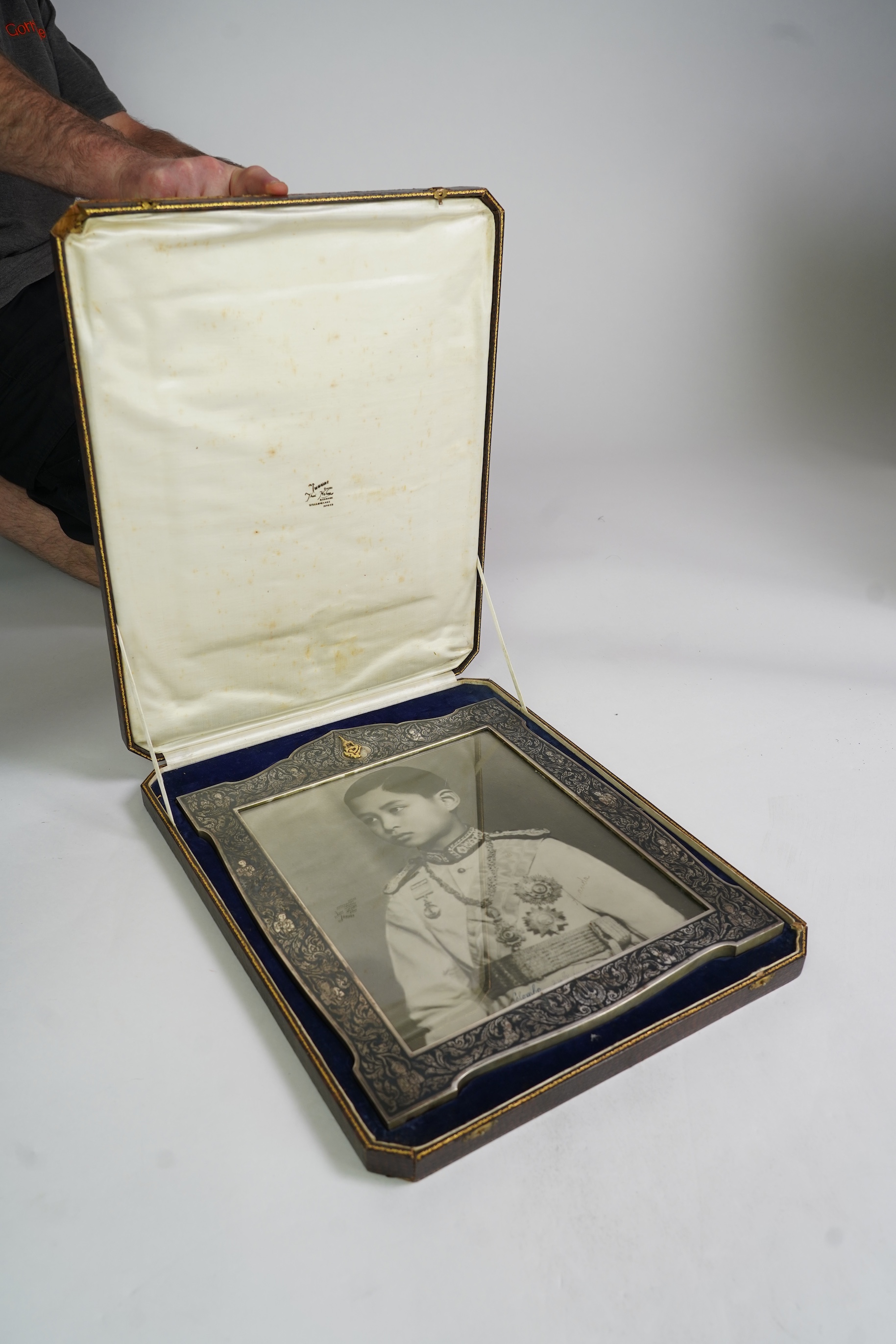 A large early 20th century Siamese silver and niello mounted rectangular photograph frame
